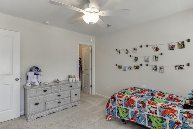 bedroom with baseboards, ceiling fan, light carpet, and visible vents