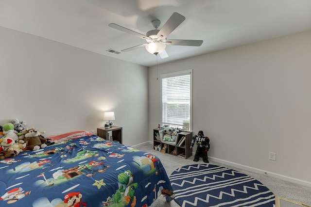 carpeted bedroom featuring baseboards, visible vents, and ceiling fan