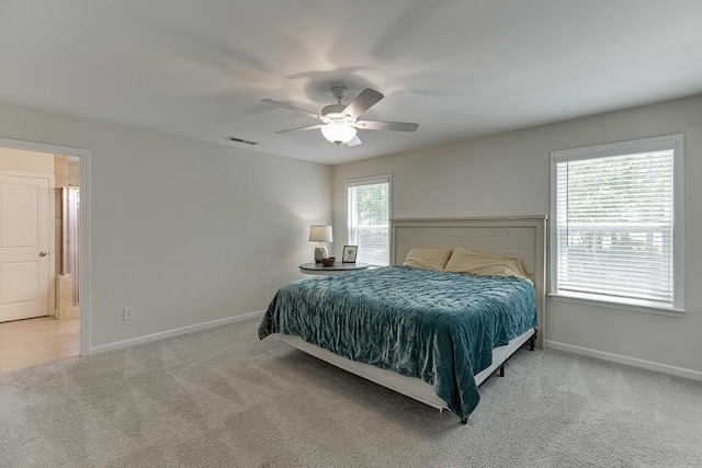bedroom with carpet flooring, baseboards, visible vents, and ceiling fan