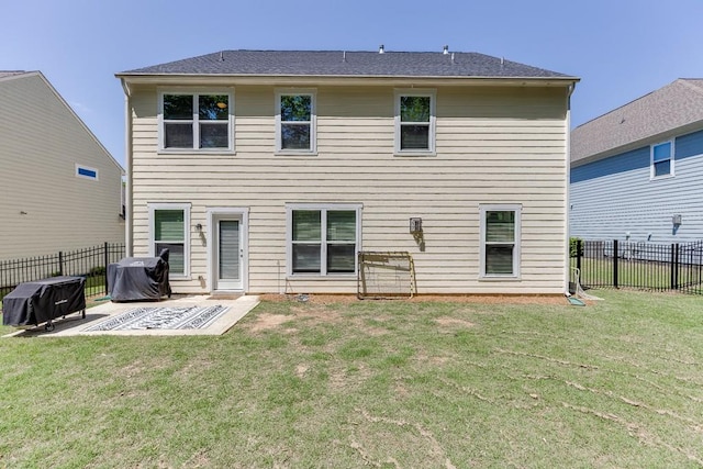 back of property featuring a fenced backyard, a patio, and a yard