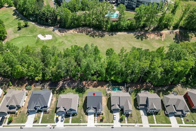 drone / aerial view featuring a residential view and golf course view