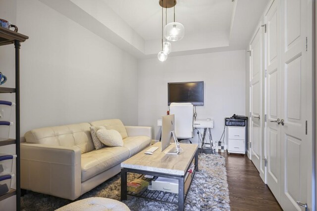 1820 Peachtree St Unit 614, Atlanta, GA 30309 - living area featuring dark wood-type flooring and a tray ceiling