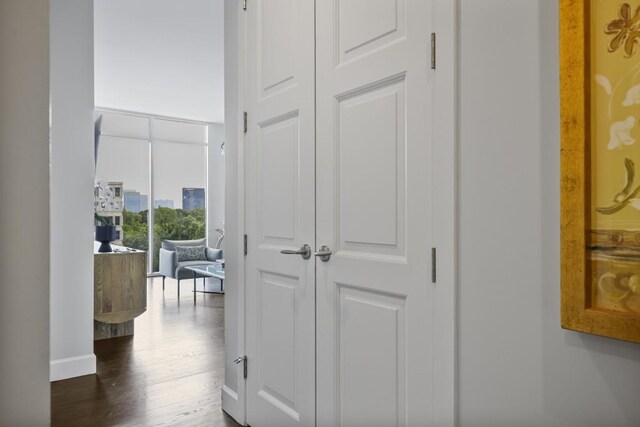 1820 Peachtree St Unit 614, Atlanta, GA 30309 - hallway featuring dark wood-type flooring and baseboards