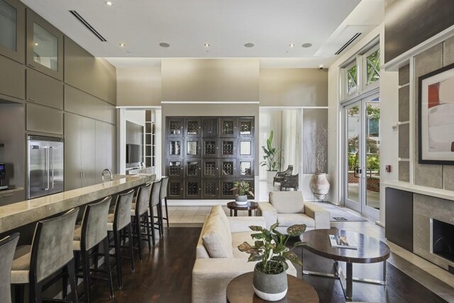 1820 Peachtree St Unit 614, Atlanta, GA 30309 - living room with a high ceiling, wood finished floors, and recessed lighting