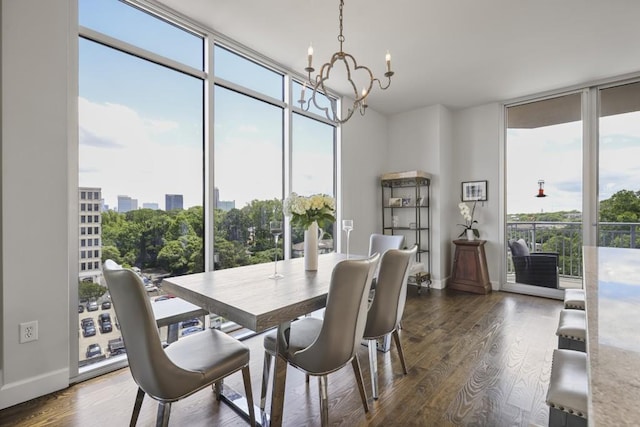 1820 Peachtree St Unit 614, Atlanta, GA 30309 - dining area featuring a wall of windows, healthy amount of natural light, a chandelier, dark wood finished floors, and baseboards