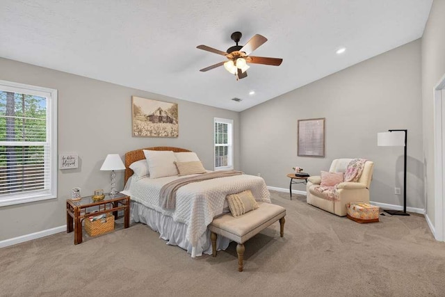 734 Evergreen Dr, Winder, GA 30680 - bedroom with light carpet, multiple windows, vaulted ceiling, ceiling fan, and recessed lighting