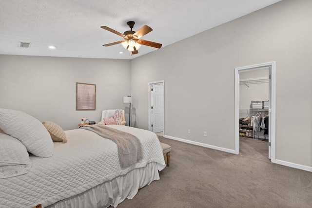 734 Evergreen Dr, Winder, GA 30680 - carpeted bedroom featuring a spacious closet, a closet, ceiling fan, and recessed lighting