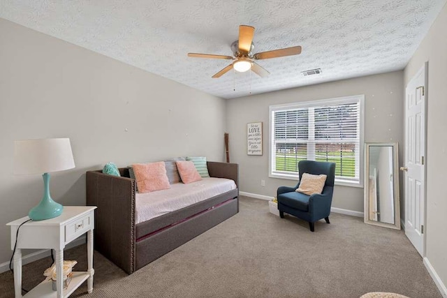 734 Evergreen Dr, Winder, GA 30680 - carpeted bedroom featuring a textured ceiling and ceiling fan