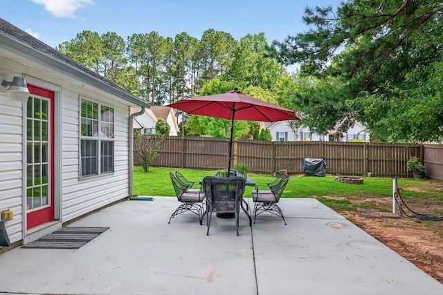 734 Evergreen Dr, Winder, GA 30680 - fenced backyard with a patio and outdoor dining space