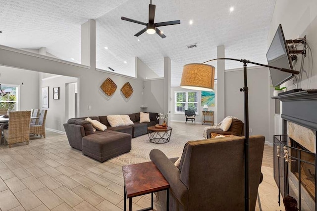 734 Evergreen Dr, Winder, GA 30680 - living area featuring ceiling fan, high vaulted ceiling, and a fireplace