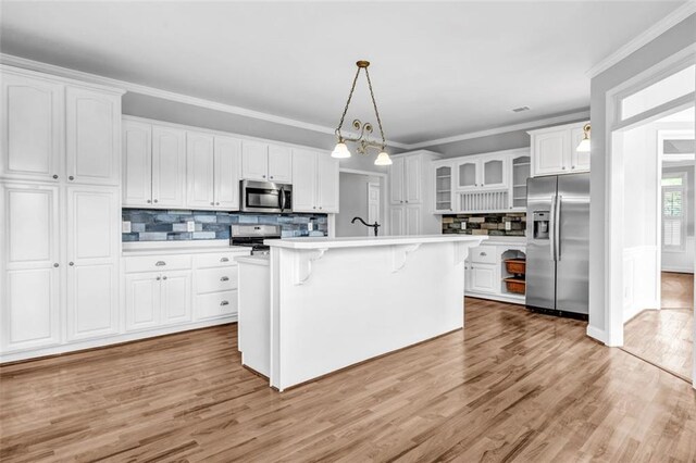 full bathroom with toilet, hardwood / wood-style flooring, bathing tub / shower combination, ornamental molding, and vanity