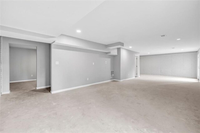 unfurnished room with light hardwood / wood-style floors, a tray ceiling, ornamental molding, and ceiling fan