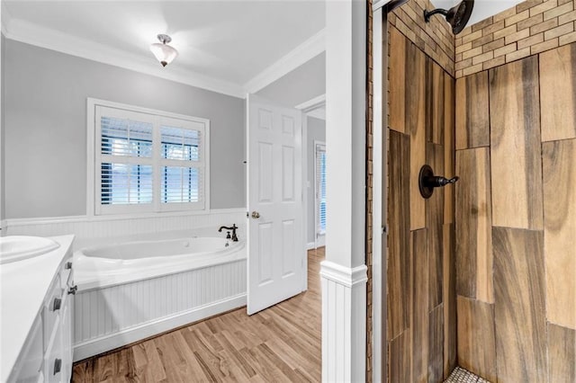 bathroom with hardwood / wood-style flooring, vanity, ornamental molding, and plus walk in shower