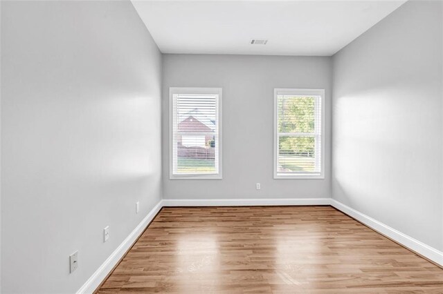 unfurnished sunroom featuring ceiling fan and french doors