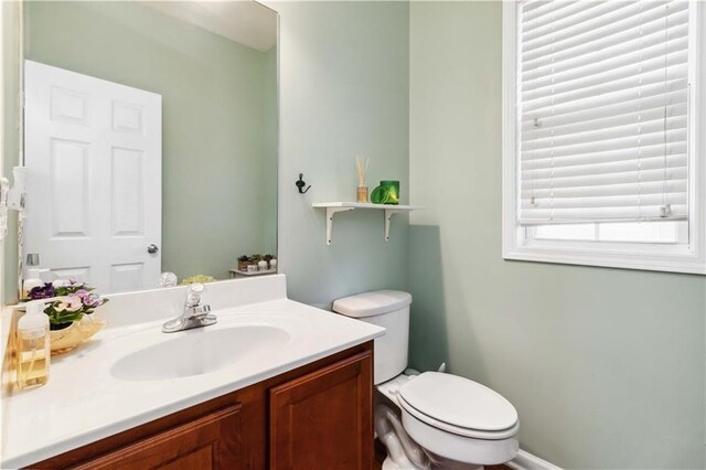 2319 White Alder Dr, Buford, GA 30519 - half bathroom featuring toilet and vanity