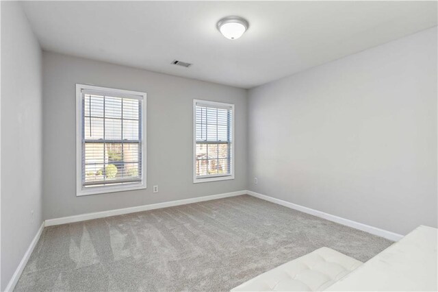 2319 White Alder Dr, Buford, GA 30519 - carpeted spare room featuring visible vents and baseboards