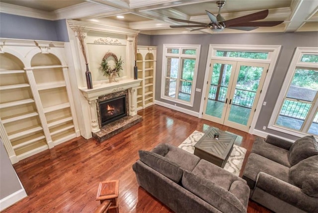 living room featuring ceiling fan, coffered ceiling, dark wood-type flooring, and french doors