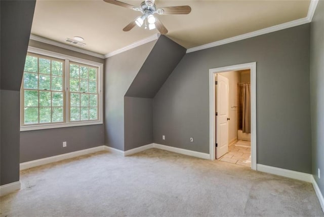 additional living space with light carpet, vaulted ceiling, and ceiling fan