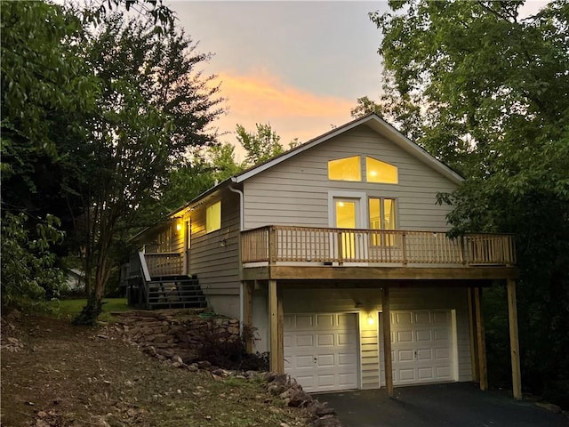 2268 Sparrow Ridge Dr NE, Marietta, GA 30066 - back of house with an attached garage, asphalt driveway, and stairs