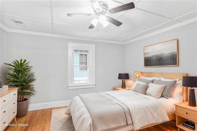 706 S Grand Ave NW, Atlanta, GA 30318 - bedroom featuring light wood-type flooring, crown molding, baseboards, and ceiling fan