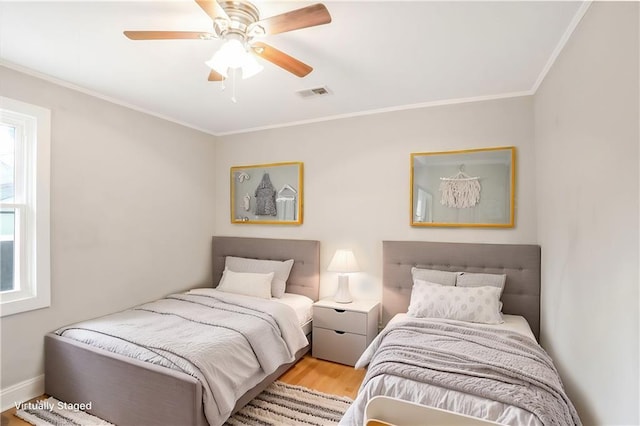 706 S Grand Ave NW, Atlanta, GA 30318 - bedroom with crown molding, wood finished floors, and a ceiling fan