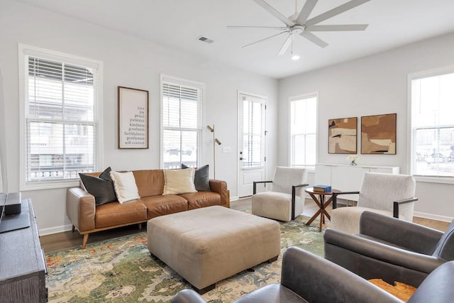 living room featuring hardwood / wood-style flooring, plenty of natural light, and ceiling fan