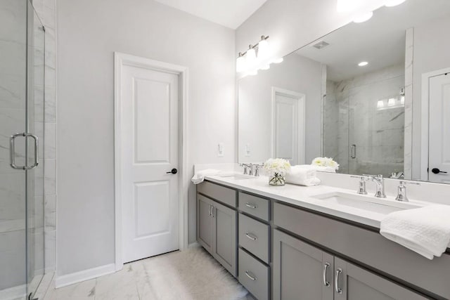 bathroom featuring vanity and an enclosed shower