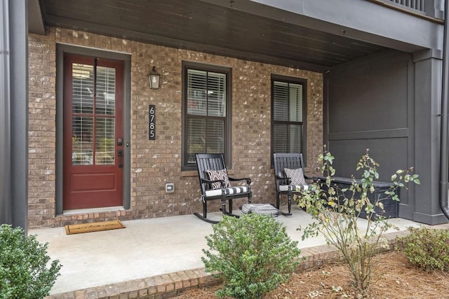 property entrance featuring covered porch