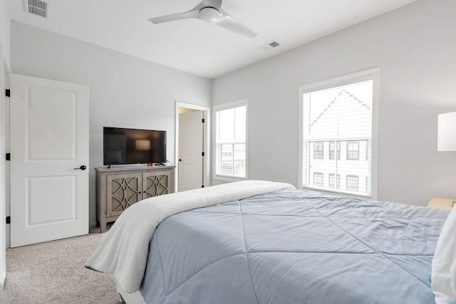 carpeted bedroom with ceiling fan