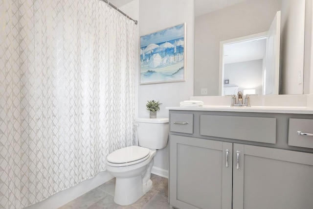 bathroom with vanity, walk in shower, and toilet