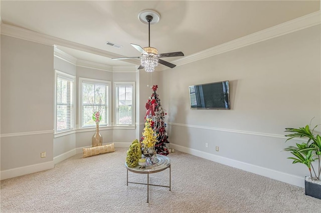 1405 Rainey Way, Hampton, GA 30228 - sitting room with a ceiling fan, carpet floors, and crown molding