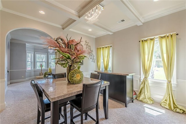 1405 Rainey Way, Hampton, GA 30228 - dining area featuring light carpet, arched walkways, beamed ceiling, crown molding, and coffered ceiling