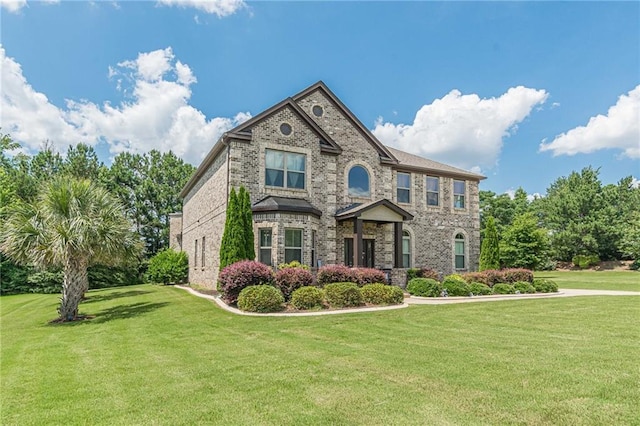 1405 Rainey Way, Hampton, GA 30228 - view of front facade featuring a front lawn and brick siding