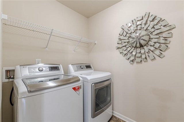 1405 Rainey Way, Hampton, GA 30228 - laundry room featuring washing machine and clothes dryer and baseboards