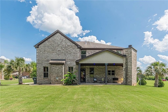 1405 Rainey Way, Hampton, GA 30228 - back of property with a lawn, brick siding, a patio area, and a chimney