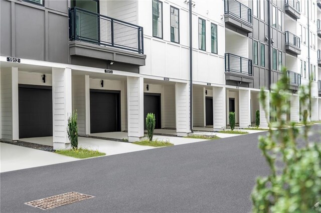 392 Pratt Dr Unit 2013, Atlanta, GA 30315 - view of building exterior with elevator and an attached garage