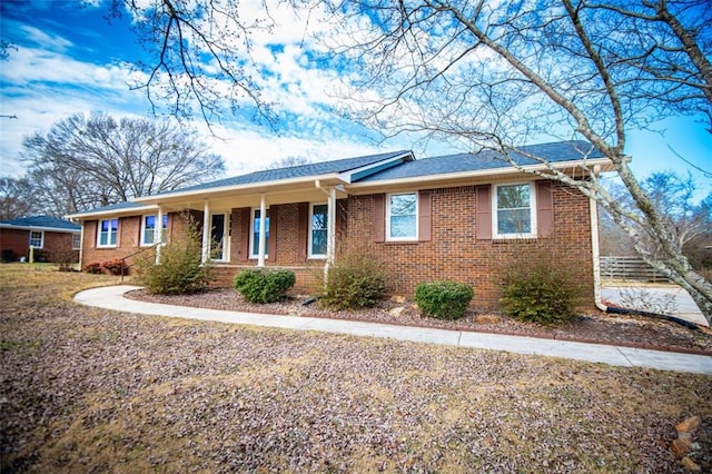 single story home with covered porch