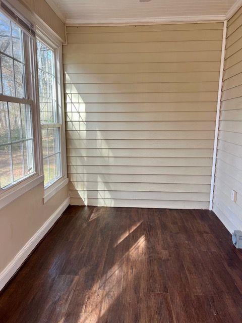 unfurnished sunroom featuring a wealth of natural light