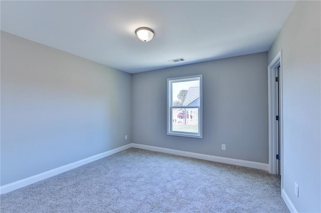 spare room featuring carpet floors