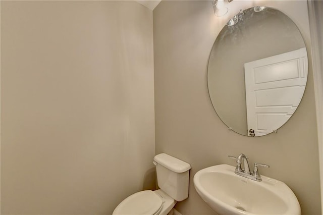 bathroom with toilet and sink