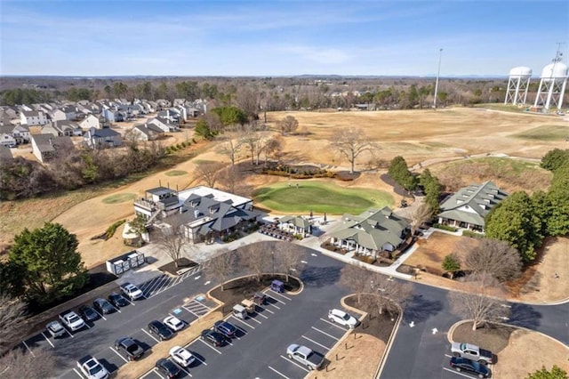 aerial view with golf course view and a residential view