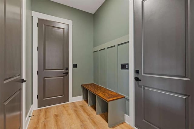 mudroom with light wood-style flooring and baseboards