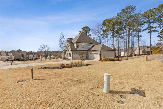 view of front of house with a garage and a front yard