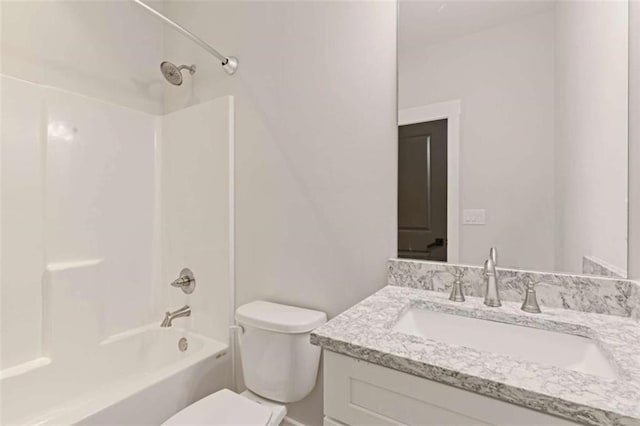 bathroom with toilet, shower / bathing tub combination, and vanity