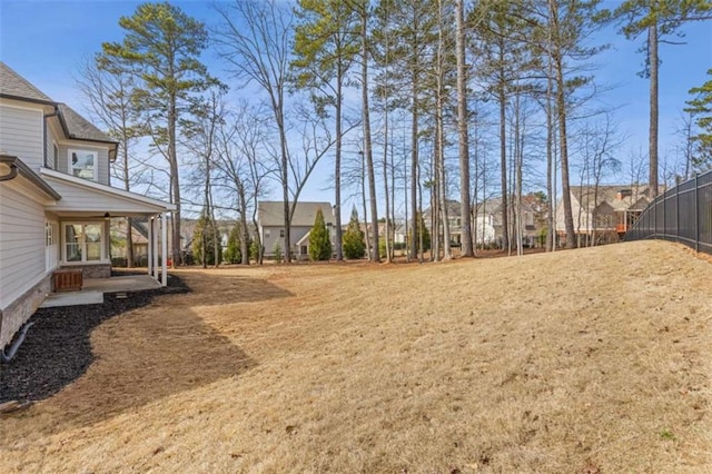 view of yard with a patio area and ceiling fan