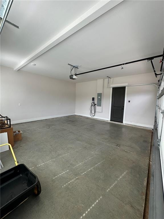 garage featuring electric panel, baseboards, and a garage door opener