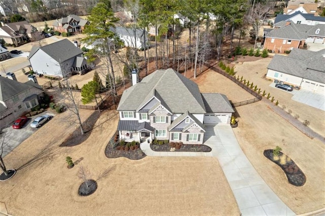 birds eye view of property with a residential view