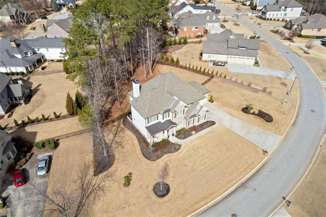 birds eye view of property with a residential view