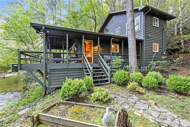 view of front of home featuring a sunroom