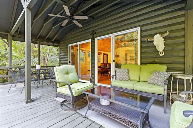 sunroom / solarium with ceiling fan and vaulted ceiling